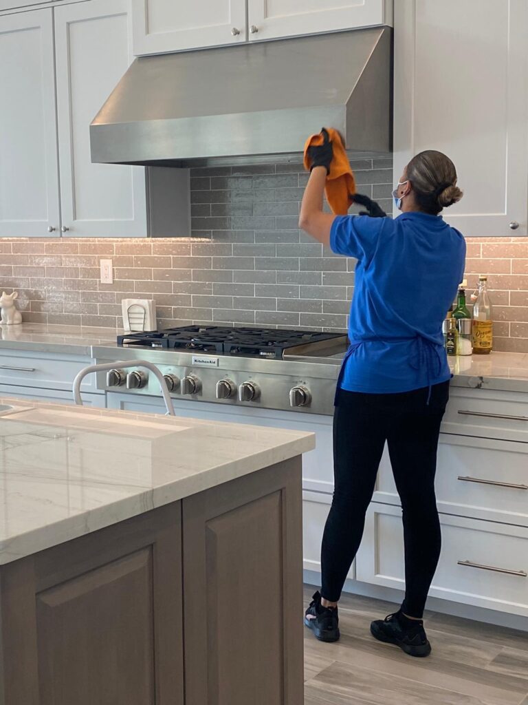 cleaning a customers kitchen